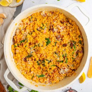 Top down photo of a white large pan full of marry me orzo.