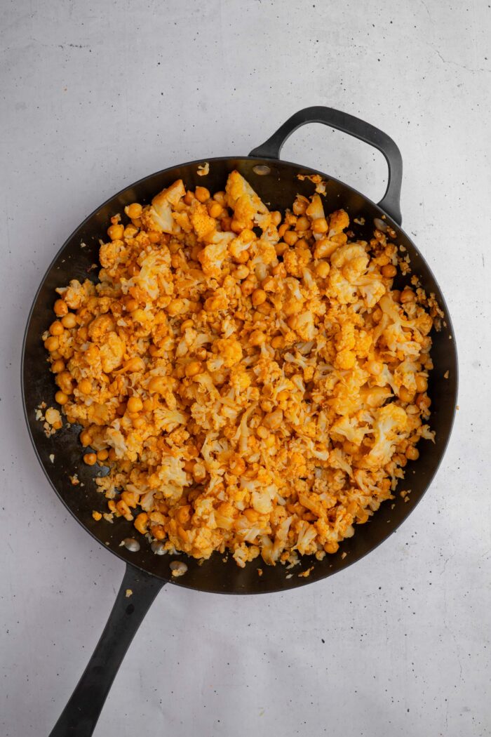 As the sauce is stirred in with the veggies, the filling is mashed up slightly into smaller chunks.