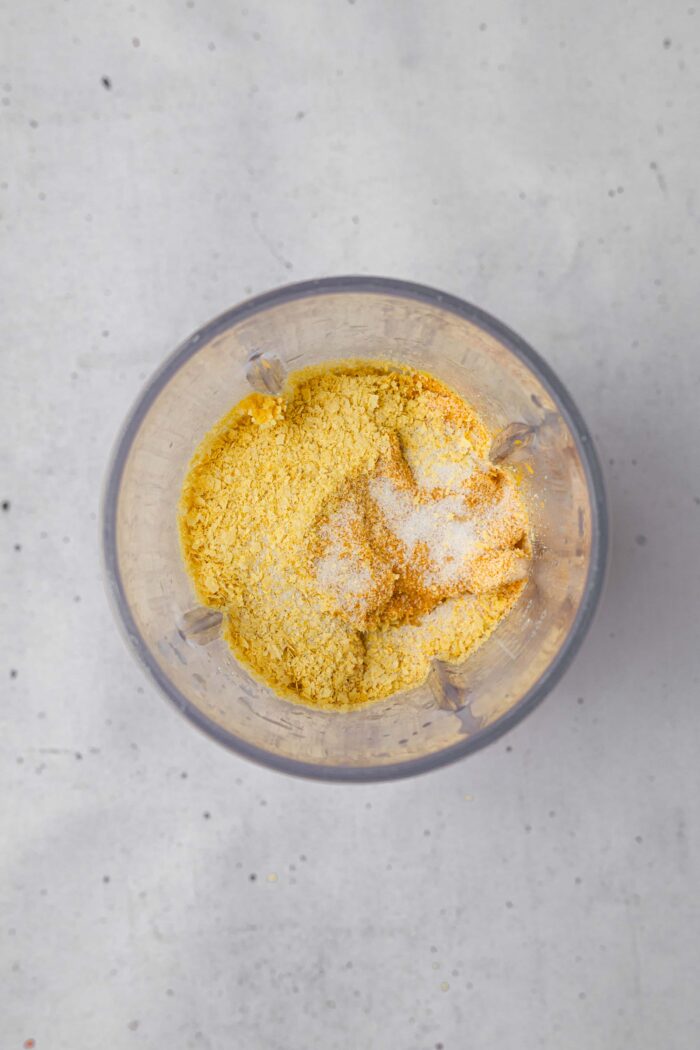The ingredients for the cashew cheese sauce dumped into a high-speed blender.