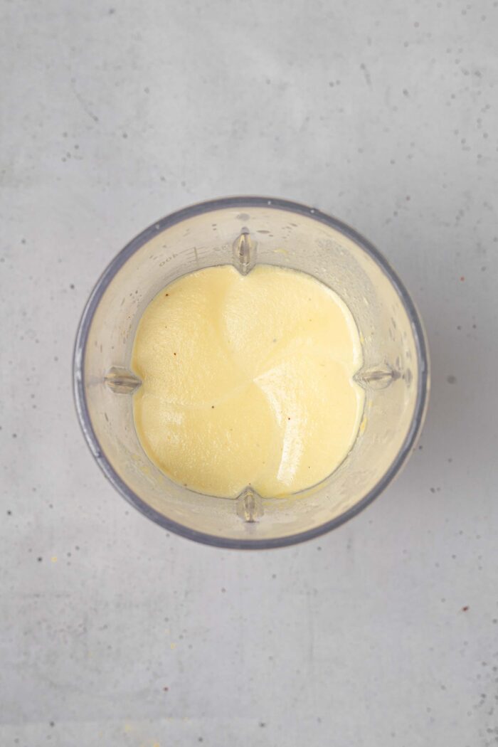Creamy vegan cashew cheese sauce to serve with sheet pan pierogies.