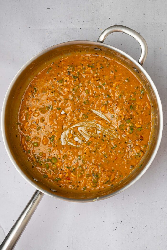 Sauce mixed with hot water until even consistency is achieved.