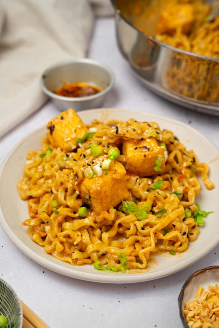 Chili oil peanut noodles served with freshly chopped scallions.