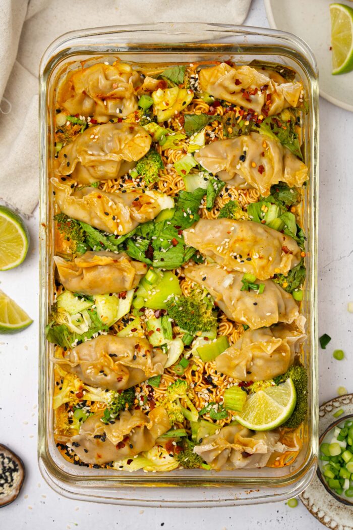 Dumpling bake, still in the baking dish, served with sesame seeds and chili flakes.