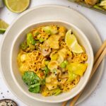 A top down view of the dumpling bake served in a bowl, with more of the dish visible in the margins.