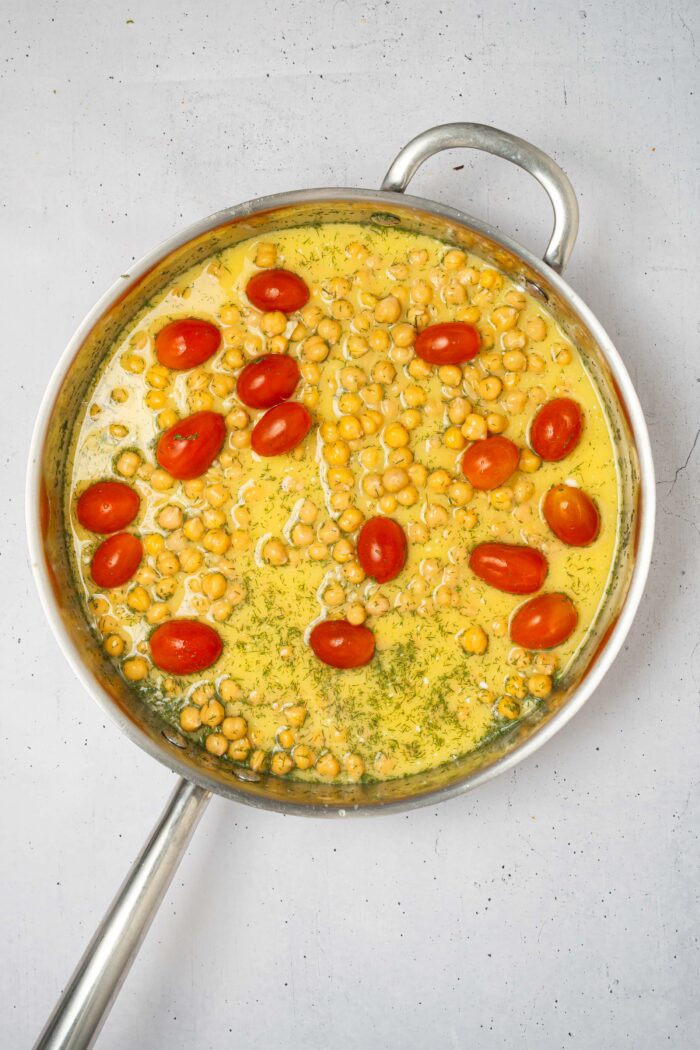 Tomatoes and chickpeas added to the orzo mixture.