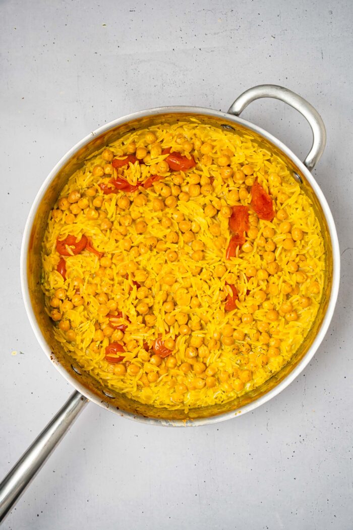 Cooked orzo with everything stirred together.