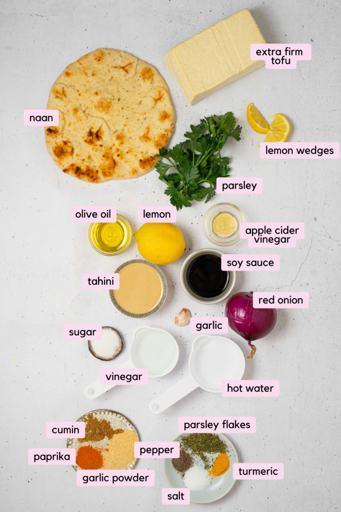 The ingredients for tofu skewers laid out and labeled on a clear white background.
