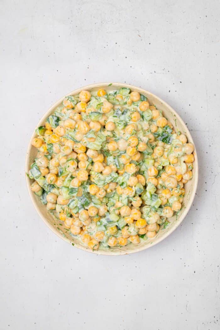 The tzatziki chickpea salad mixed together in a bowl.