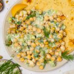 Pita served with tzatziki chickpea salad on a plate.