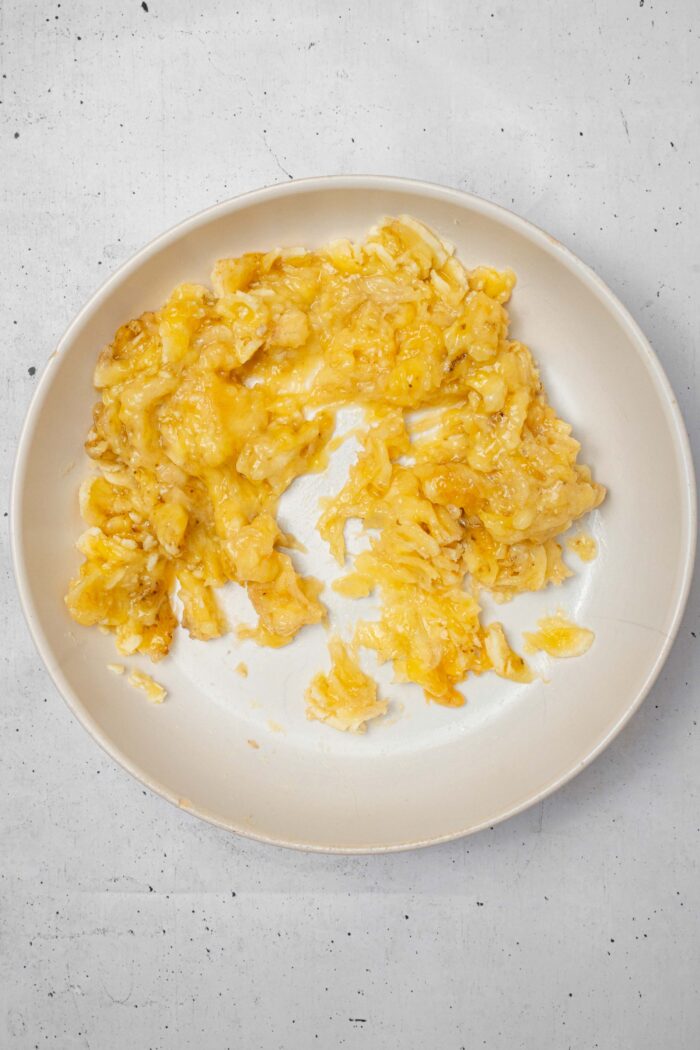 Mashed banana in a bowl.