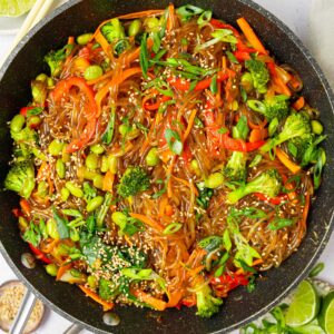A pan containing glass noodle stir fry, ready to serve.