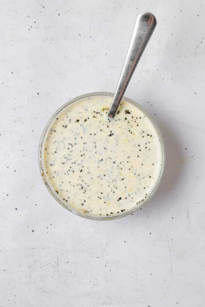 The creamy dressing for the shredded tofu salad mixed together in a bowl.