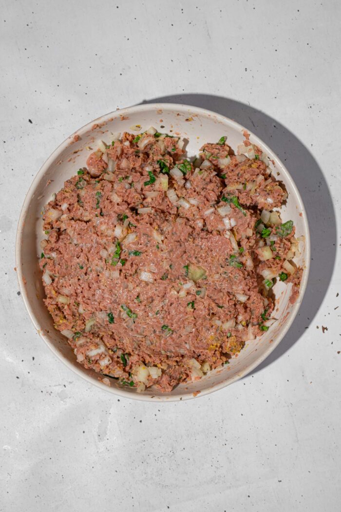 The vegan beef filling for the cabbage rolls mixed all together in a bowl.