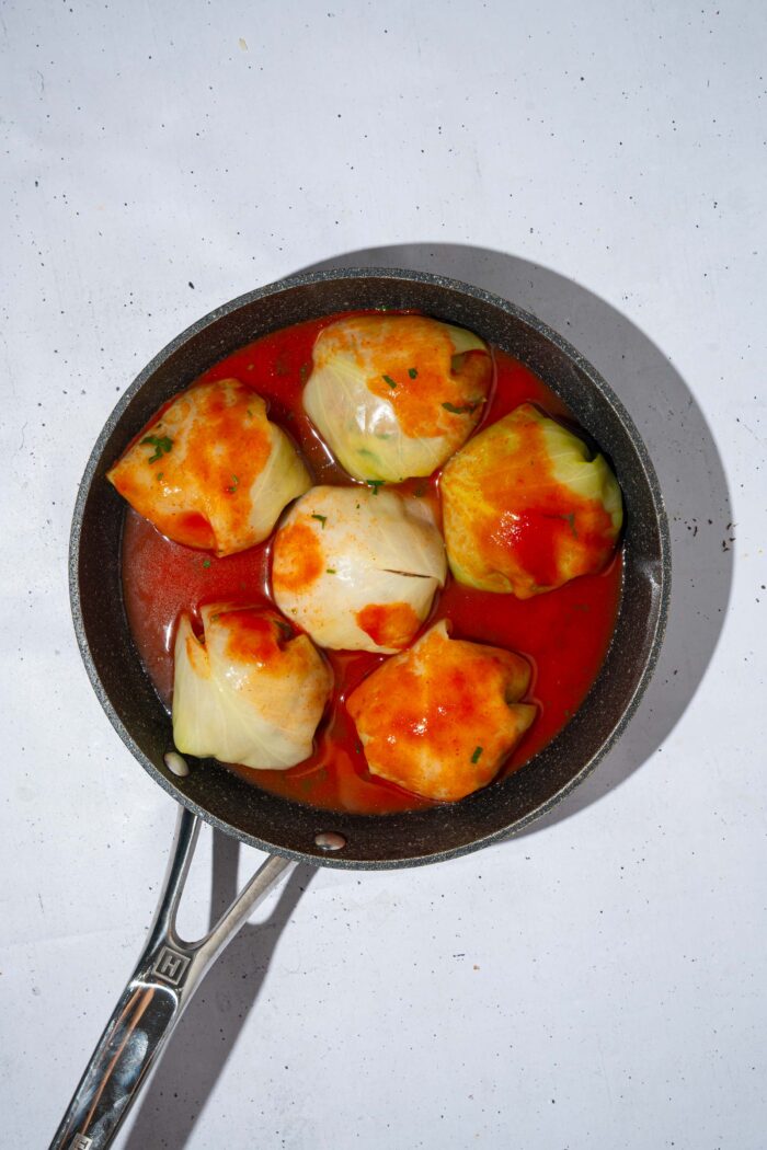 Sauce poured over the vegan cabbage rolls.