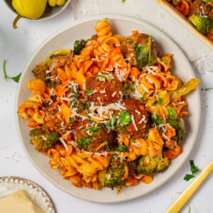 Top down view of vegan pasta and meatball bake served on a plate.