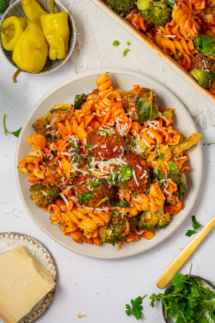 Top down view of vegan pasta and meatball bake served on a plate.