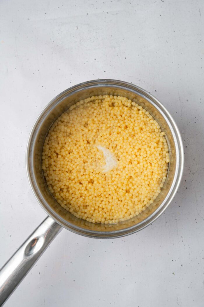 Pearl couscous after being cooked in the steel pot.