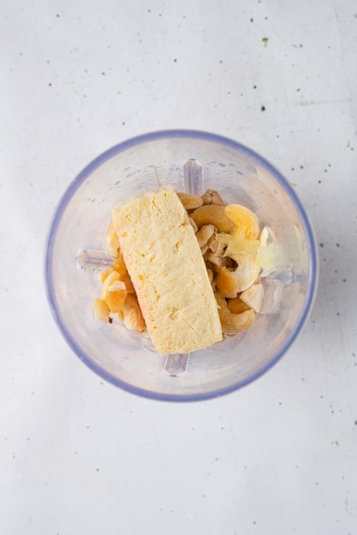 Whipped tofu ingredients in a high-speed blender.