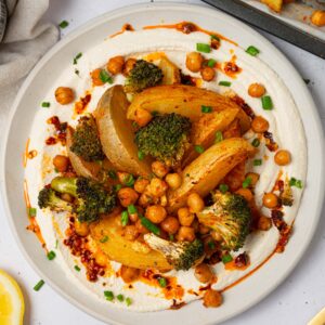 The sheet pan vegetables and chickpeas served on a bed of whipped tofu.