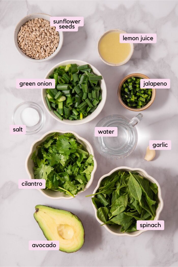 The ingredients for the everything green sauce laid out and labeled on a light background.