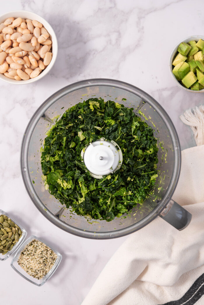 Kale shredded in a food processor.