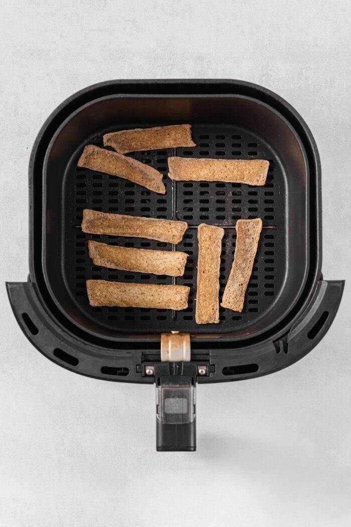 Tofu strips cooked in an air fryer.