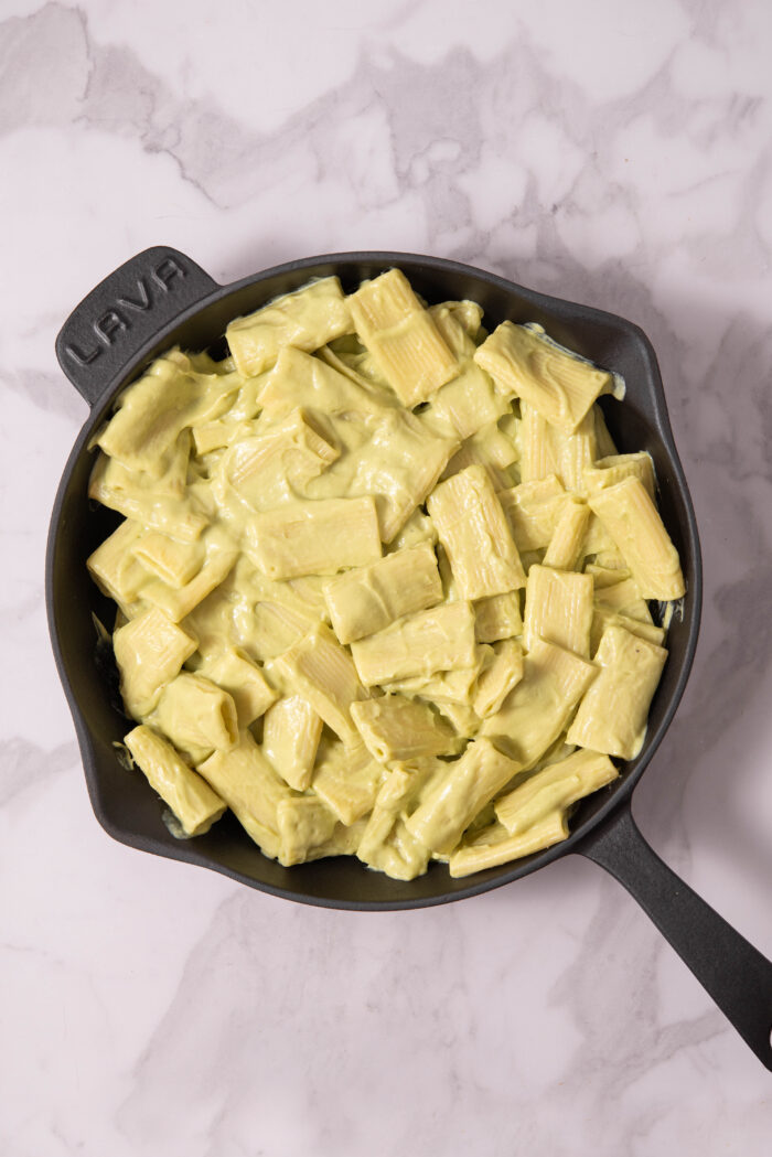 Pasta mixed together with bthe silky avocado sauce.