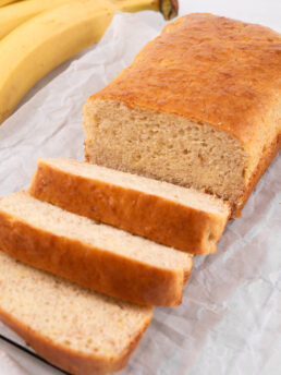 A close up of the easy vegan banana bread sliced into one end.