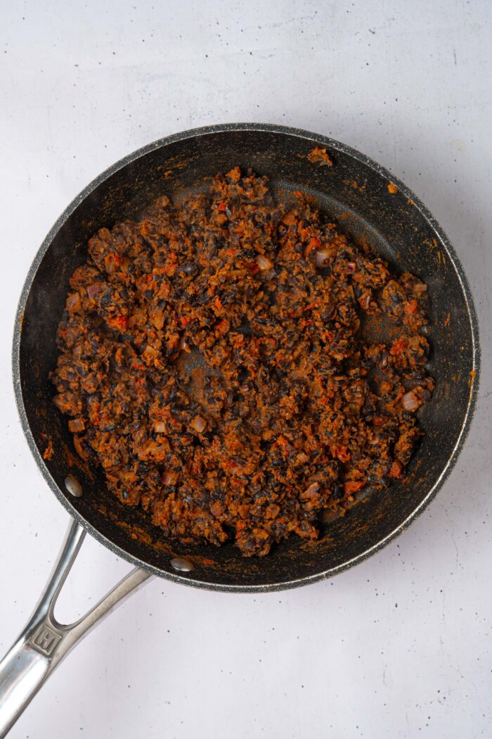 Cooked and mashed black bean topping for the smashed potato nachos.