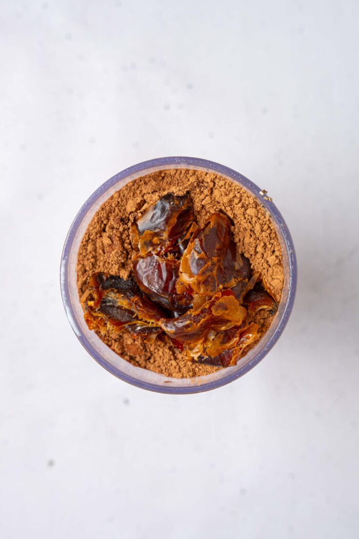 The ingredients for the blended chocolate chia pudding all together in a high-speed blender.