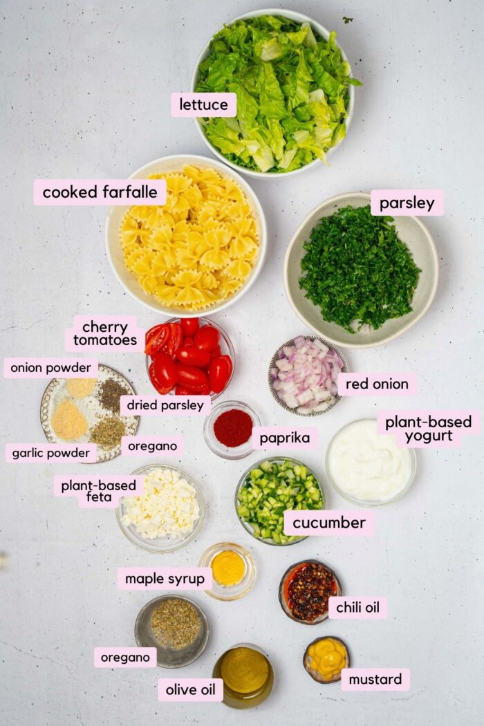Ingredients for the crispy pasta salad, laid out and labeled on a clear white background.